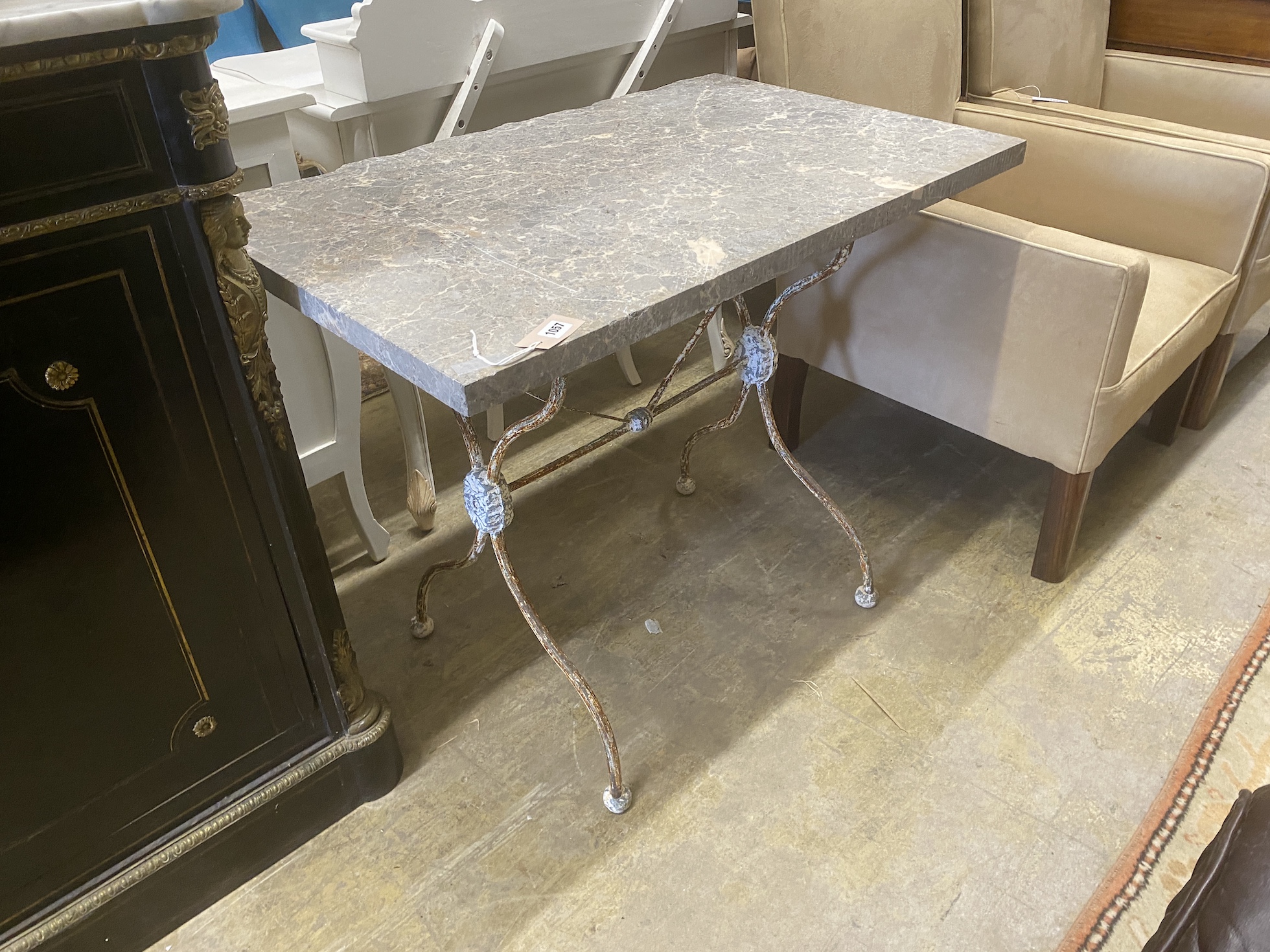 A rectangular marble topped wrought iron garden table, width 93cm, depth 60cm, height 73cm